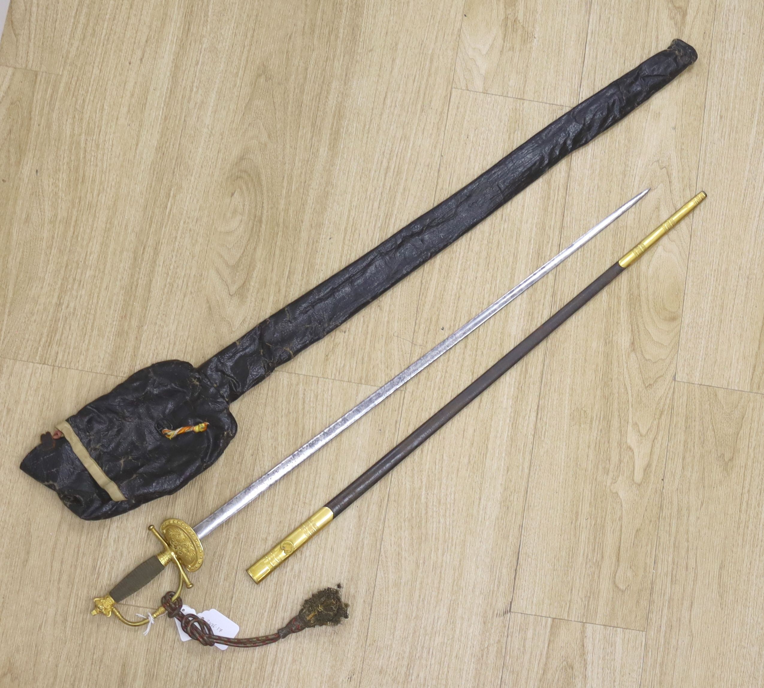 A Victorian court sword, blade by Lambert Brown & Clowes, Dublin & London (1846 – 1858) with crowned VR cypher, crossed flags and foliage, gilt brass hilt and leather scabbard mounts, bullion dress knot, in its oilskin b